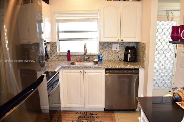 kitchen with white cabinets, dishwasher, white fridge, and sink