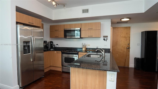 350 S Miami Ave Unit 2905, Miami, FL 33130 - kitchen featuring stainless steel appliances, a peninsula, dark wood-style flooring, and dark stone countertops