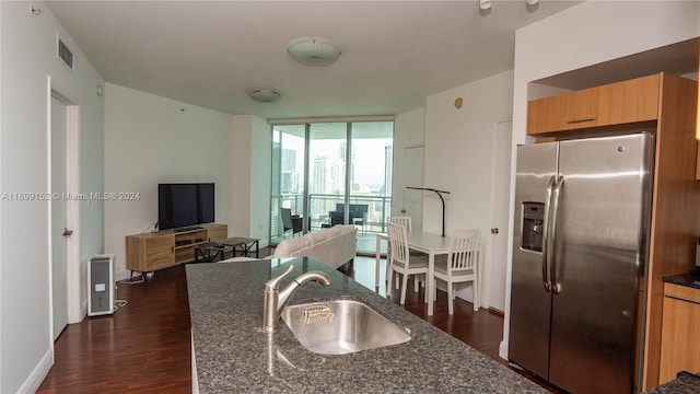 350 S Miami Ave Unit 2905, Miami, FL 33130 - kitchen with stainless steel fridge with ice dispenser, expansive windows, dark wood-style floors, dark stone counters, and modern cabinets