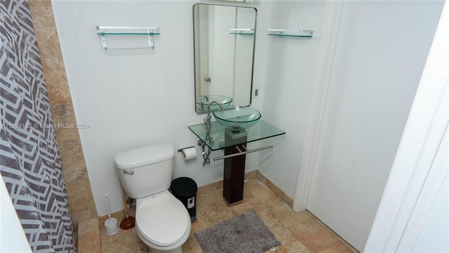 bathroom with toilet and sink