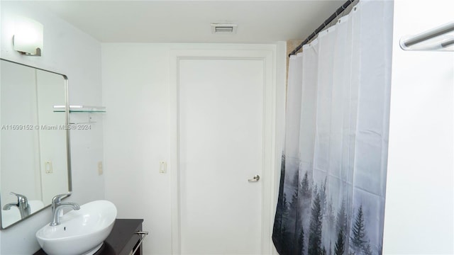 bathroom featuring vanity and walk in shower