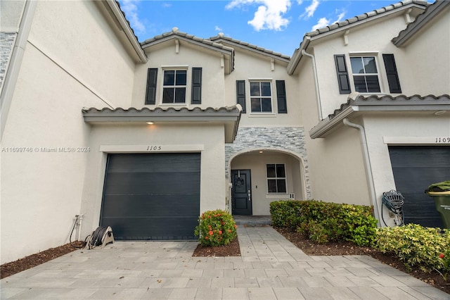 entrance to property featuring a garage