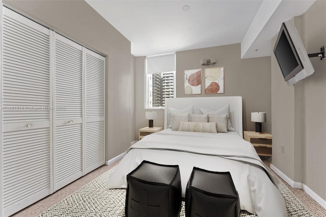 bedroom with carpet floors and a closet