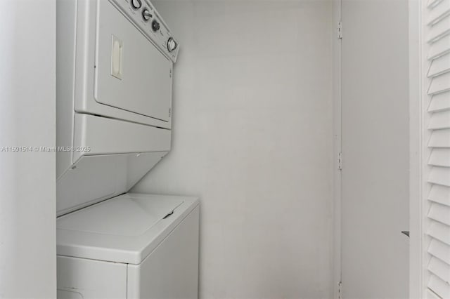 washroom with stacked washer / drying machine