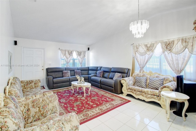 living room with tile patterned floors, lofted ceiling, and a chandelier