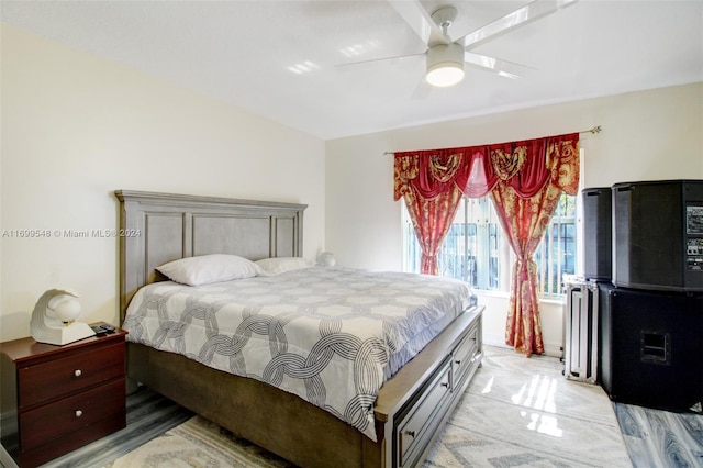 bedroom featuring ceiling fan and light wood-type flooring