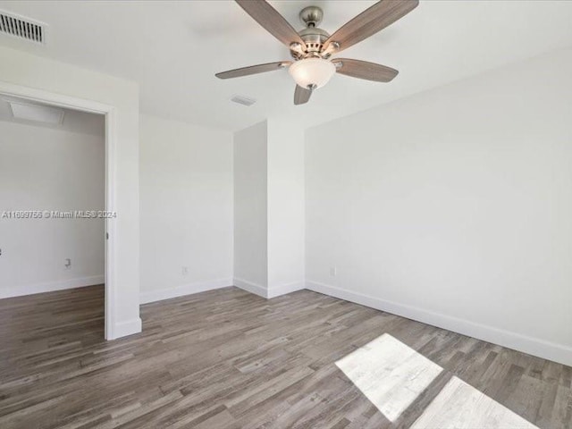 unfurnished bedroom with a closet, hardwood / wood-style flooring, and ceiling fan