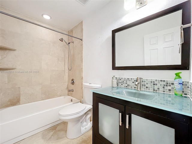 full bathroom with decorative backsplash, vanity, tile patterned flooring, toilet, and tiled shower / bath