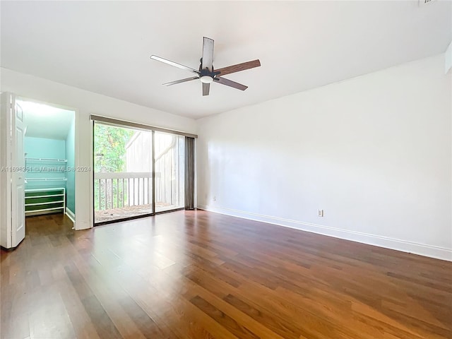 unfurnished room featuring vaulted ceiling, ceiling fan, and dark hardwood / wood-style floors