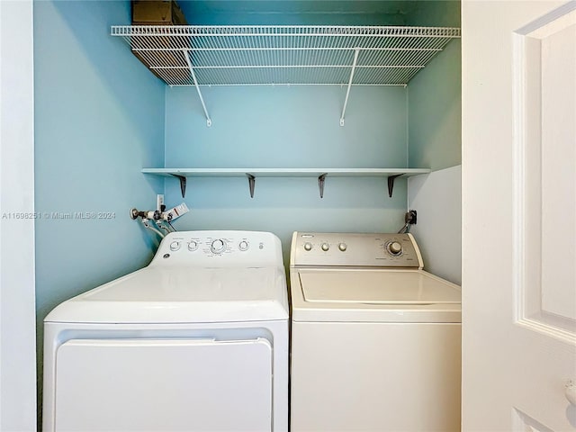 laundry area featuring washing machine and clothes dryer