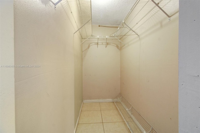 spacious closet with tile patterned flooring