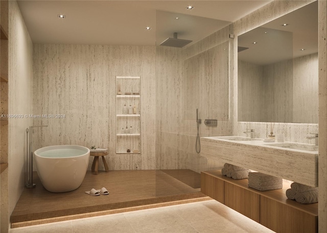 bathroom featuring tile patterned flooring, vanity, and plus walk in shower