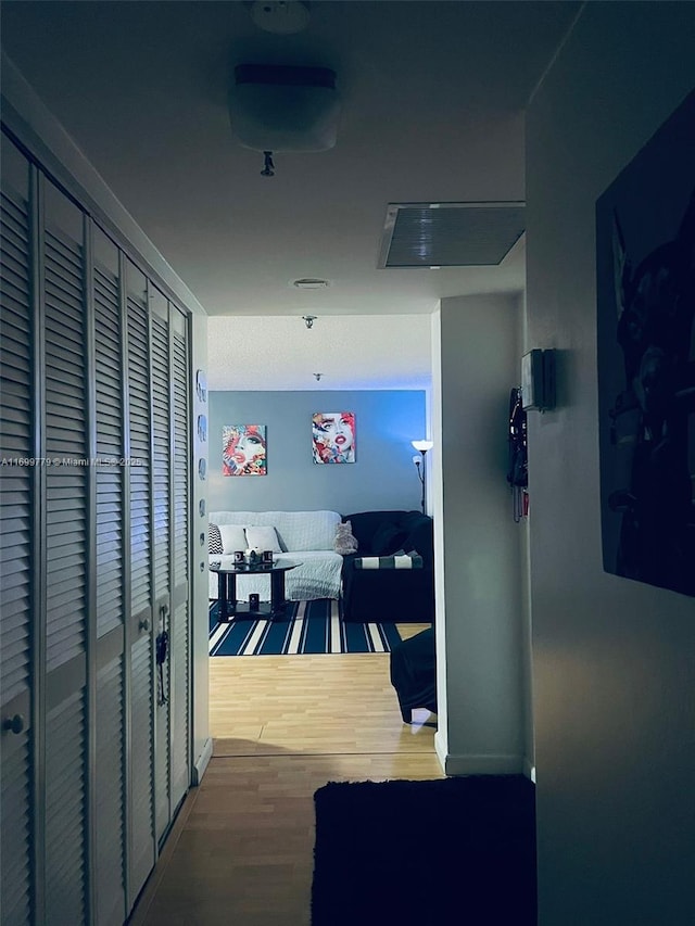 hallway featuring hardwood / wood-style flooring