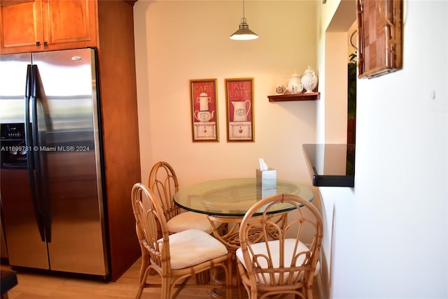 dining space with light hardwood / wood-style floors