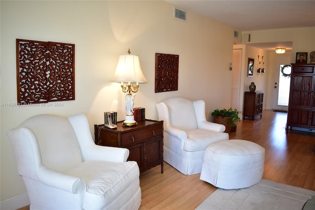 sitting room featuring light hardwood / wood-style floors