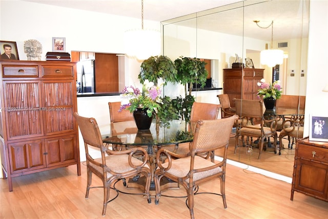 dining area with light hardwood / wood-style flooring