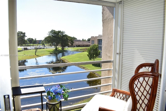 balcony featuring a water view