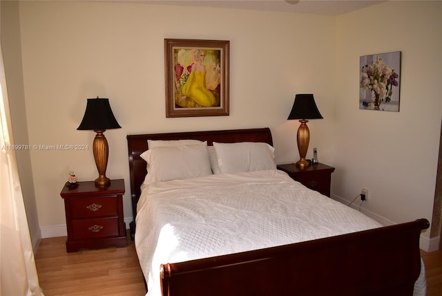 bedroom with light hardwood / wood-style flooring