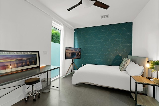 bedroom with tile walls and ceiling fan