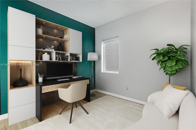 315 NE 7th St, Fort Lauderdale, FL 33304 - office area with built in desk, wood finished floors, and baseboards