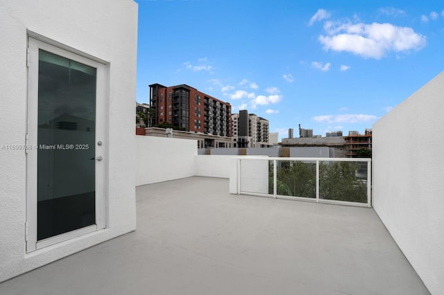 view of patio with a balcony