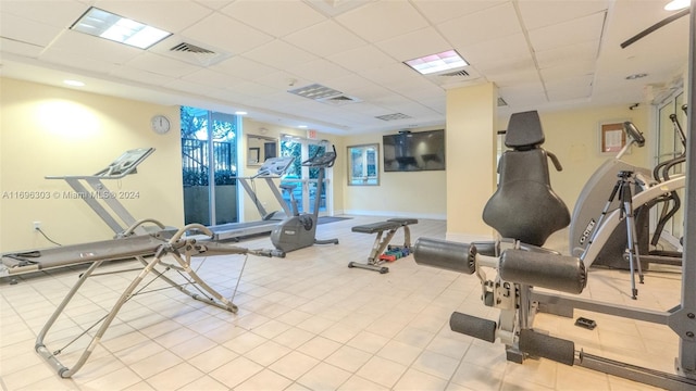 exercise room featuring a paneled ceiling