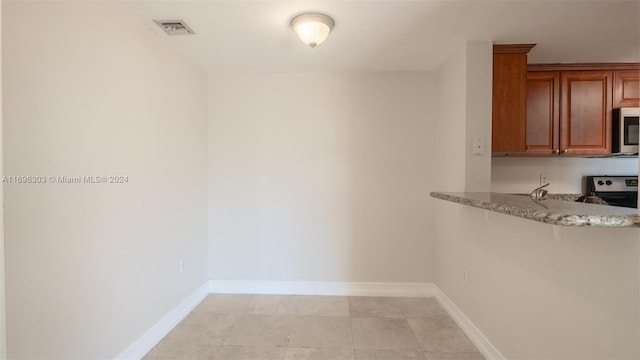 unfurnished dining area with light tile patterned floors