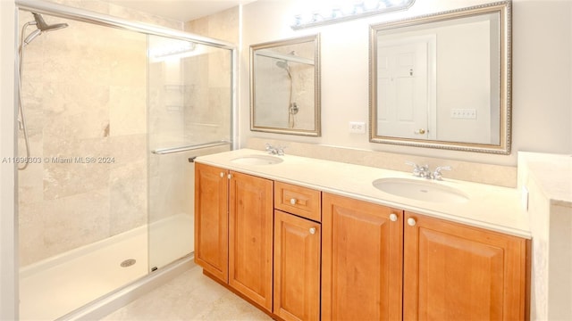 bathroom featuring vanity and an enclosed shower