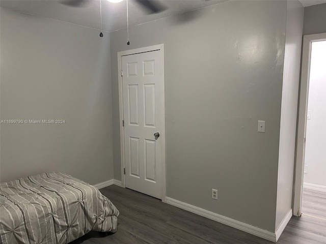 bedroom featuring hardwood / wood-style floors and ceiling fan