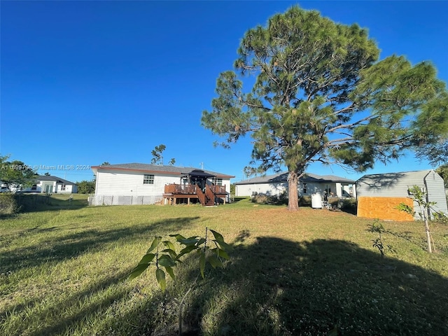 view of yard featuring a wooden deck