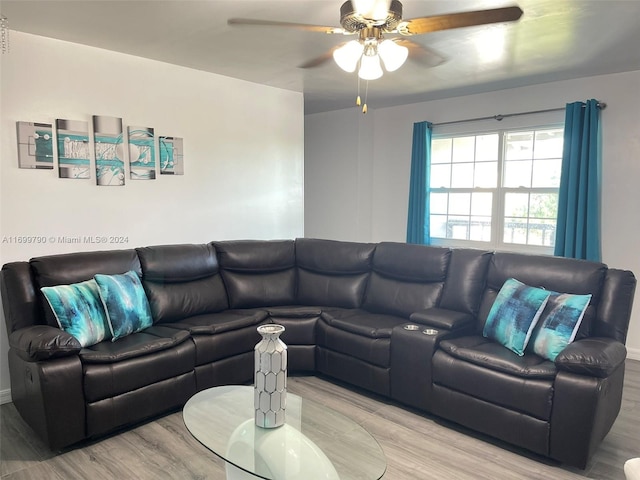 living room with ceiling fan and light hardwood / wood-style flooring