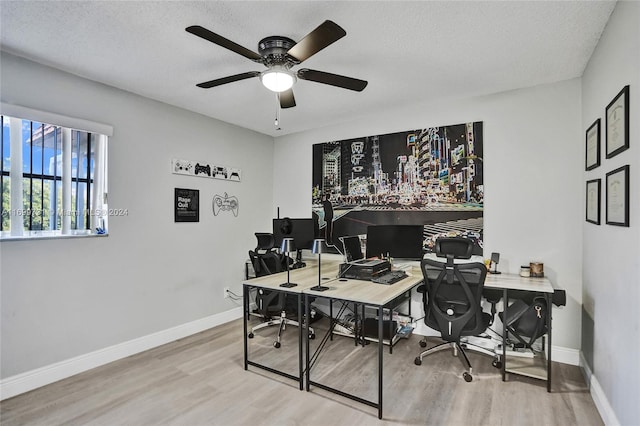 office space featuring ceiling fan, a textured ceiling, and hardwood / wood-style flooring