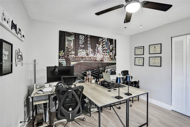 office area with hardwood / wood-style floors, a textured ceiling, and ceiling fan