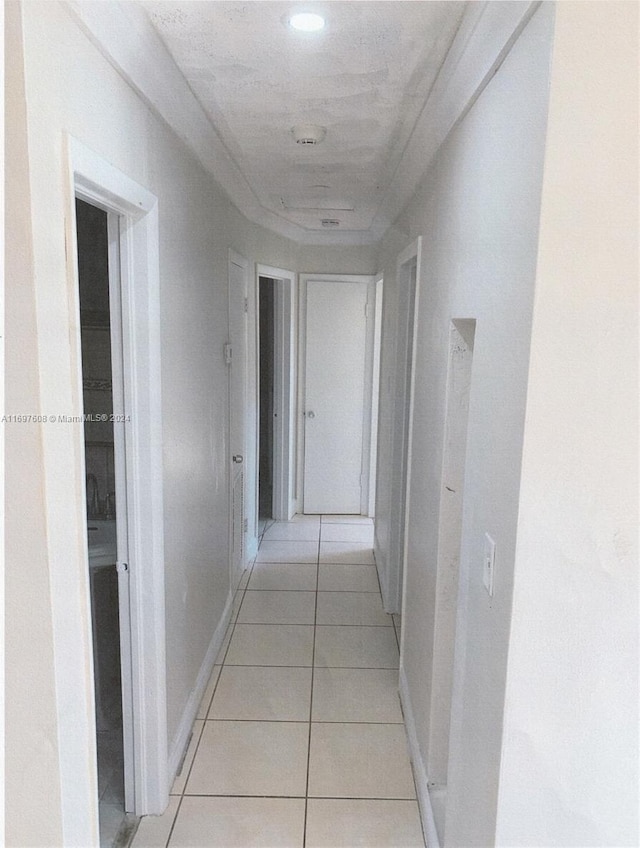 corridor featuring light tile patterned flooring