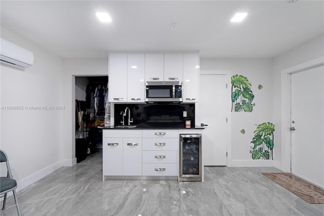 kitchen featuring white cabinets, beverage cooler, sink, tasteful backsplash, and a wall unit AC