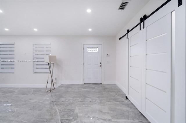 entrance foyer featuring a barn door