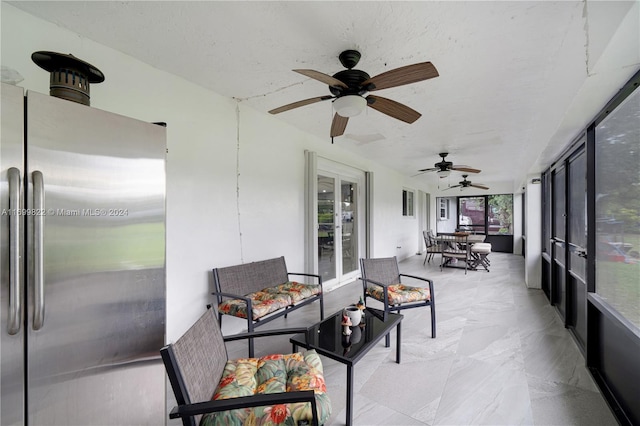 sunroom / solarium with ceiling fan