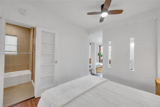 bedroom with ceiling fan and hardwood / wood-style flooring