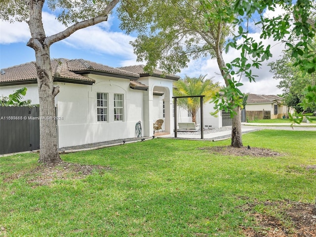 mediterranean / spanish house with a front yard