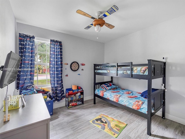 bedroom featuring ceiling fan and light hardwood / wood-style flooring