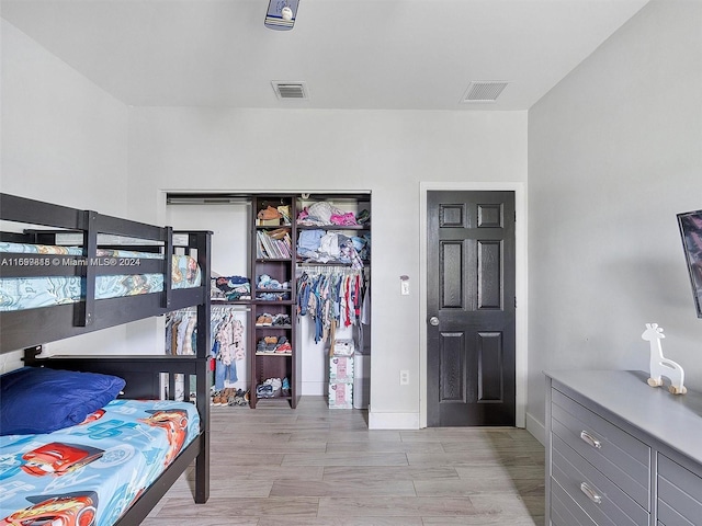 bedroom with light wood-type flooring