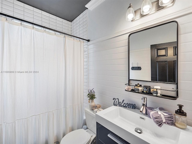 bathroom with wooden walls, vanity, a shower with shower curtain, and toilet