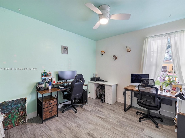 office space with ceiling fan and light hardwood / wood-style floors