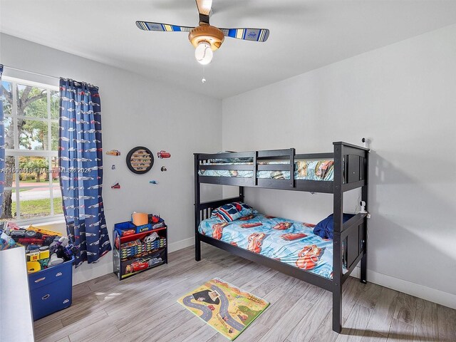 bedroom featuring hardwood / wood-style floors and ceiling fan