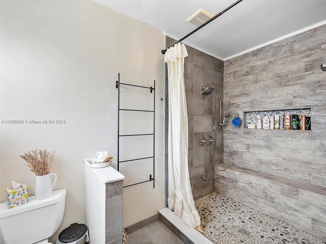 bathroom with toilet and walk in shower