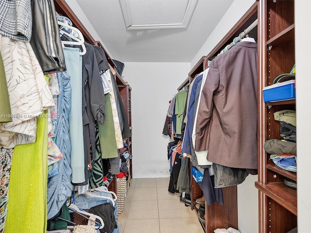 spacious closet featuring light tile patterned floors