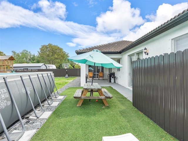 view of yard with a patio area