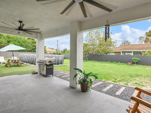 view of patio featuring ceiling fan and area for grilling