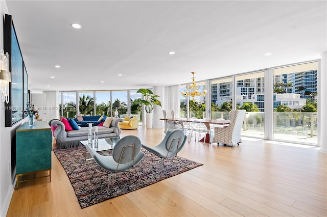 living room featuring plenty of natural light and light hardwood / wood-style floors