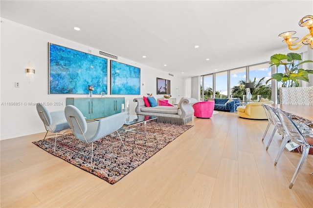 living room with hardwood / wood-style floors and a wall of windows